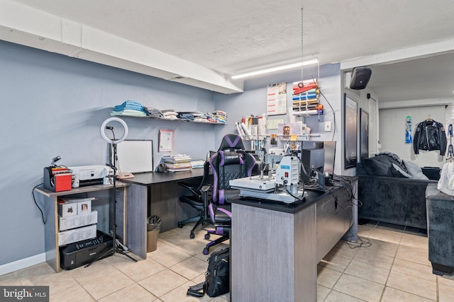 office featuring tile patterned flooring and a textured ceiling