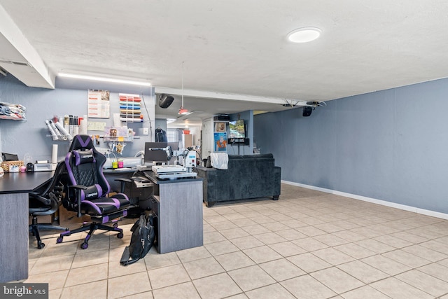 office area featuring baseboards and tile patterned flooring