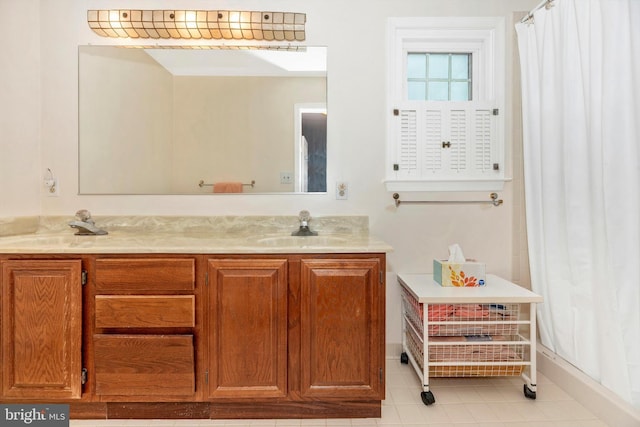 full bathroom with double vanity, tile patterned flooring, and a shower with shower curtain