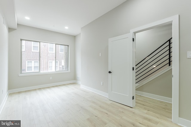 3233 Mercer St, Philadelphia, PA 19134 - unfurnished room featuring wood finished floors, baseboards, stairway, and recessed lighting