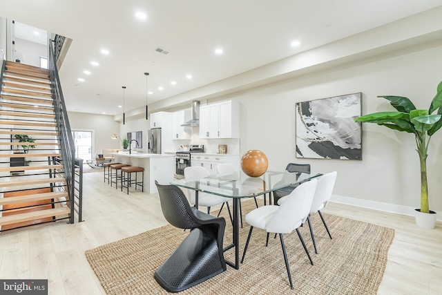 3233 Mercer St, Philadelphia, PA 19134 - dining area featuring stairway, light wood-style floors, and recessed lighting
