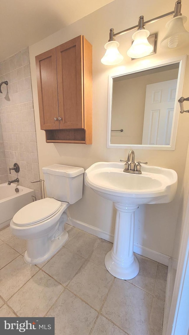 19503 Fetlock Dr, Germantown, MD 20874 - bathroom with toilet, baseboards, tile patterned flooring, and shower / bath combination