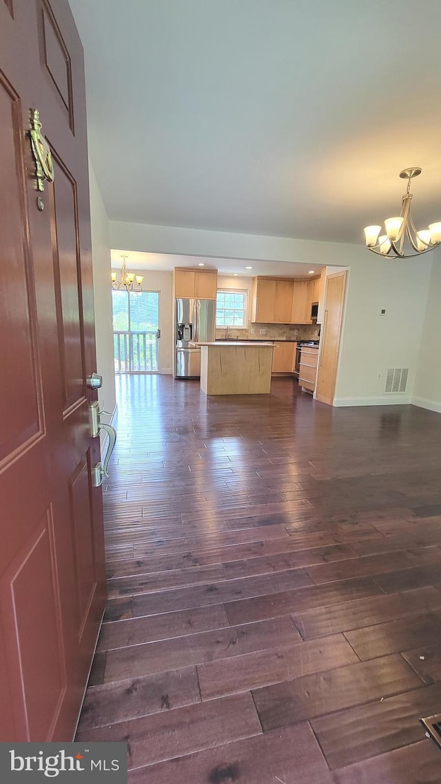 19503 Fetlock Dr, Germantown, MD 20874 - unfurnished living room with a chandelier, dark wood-style flooring, and baseboards