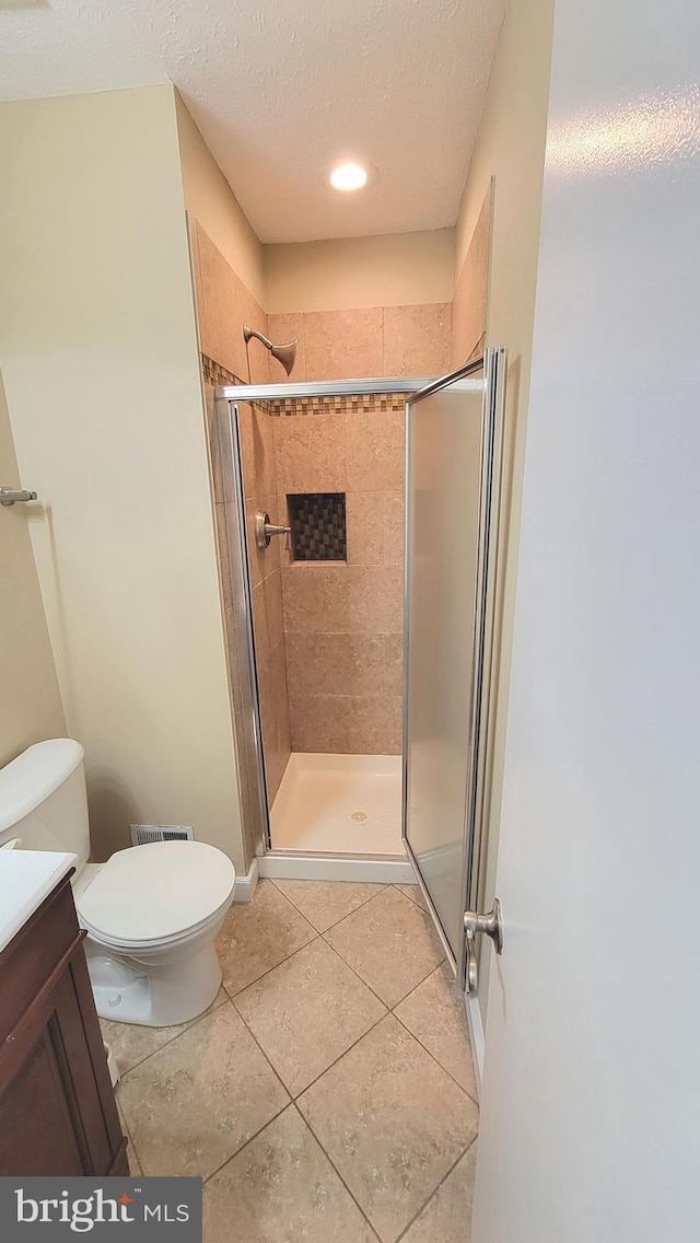 19503 Fetlock Dr, Germantown, MD 20874 - full bath with toilet, a stall shower, vanity, and tile patterned flooring