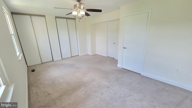 19503 Fetlock Dr, Germantown, MD 20874 - unfurnished bedroom with multiple closets, carpet flooring, baseboards, and ceiling fan