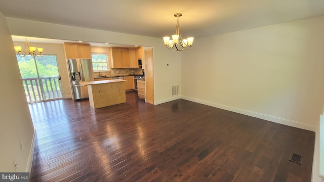19503 Fetlock Dr, Germantown, MD 20874 - kitchen with a chandelier, stainless steel appliances, and dark wood finished floors