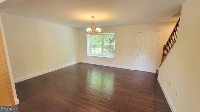 19503 Fetlock Dr, Germantown, MD 20874 - spare room featuring stairs, a chandelier, dark wood-style flooring, and baseboards