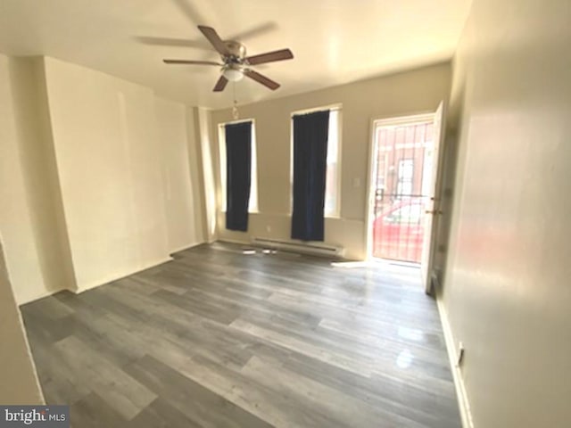 433 E Auburn St, Philadelphia, PA 19134 - unfurnished room featuring a ceiling fan, dark wood-style flooring, and a baseboard radiator