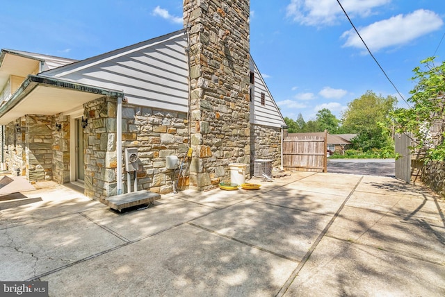 view of patio featuring fence