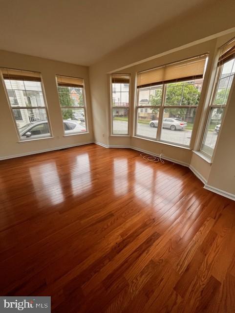 1910 Scaffold Way, Odenton, MD 21113 - spare room with plenty of natural light, wood finished floors, and baseboards