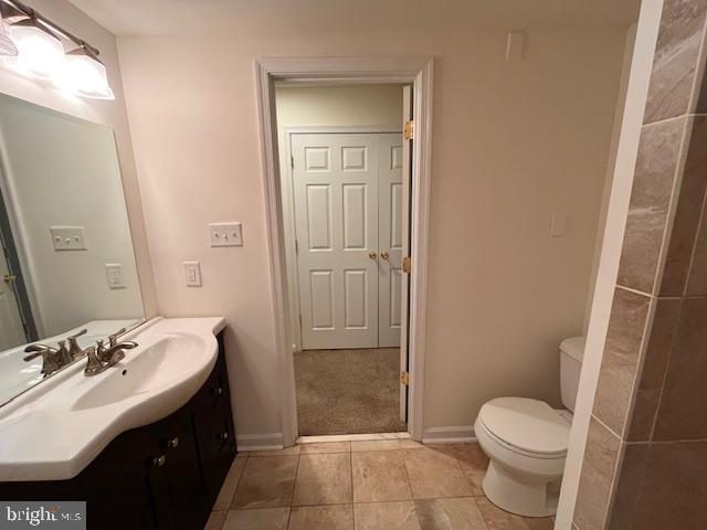 1910 Scaffold Way, Odenton, MD 21113 - bathroom featuring vanity, toilet, tile patterned flooring, and baseboards
