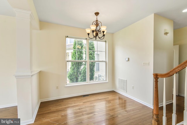 1910 Scaffold Way, Odenton, MD 21113 - unfurnished dining area featuring plenty of natural light, hardwood / wood-style floors, a chandelier, and baseboards
