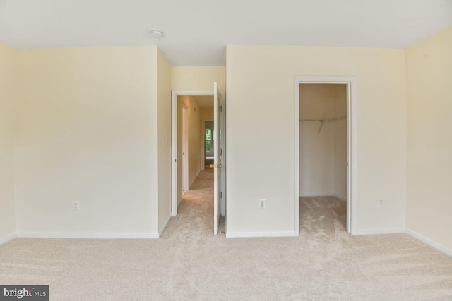 1910 Scaffold Way, Odenton, MD 21113 - unfurnished bedroom featuring light colored carpet, a spacious closet, and baseboards