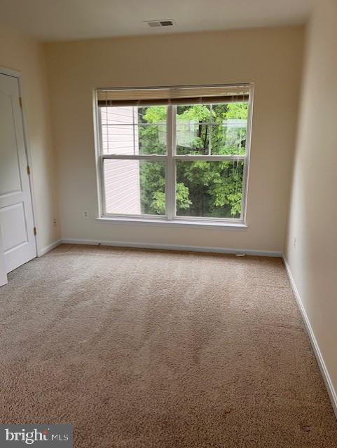 1910 Scaffold Way, Odenton, MD 21113 - carpeted spare room featuring plenty of natural light and baseboards