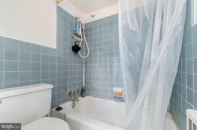 922 24th St NW Unit 313, Washington, DC 20037 - bathroom featuring shower / bath combo and tile walls