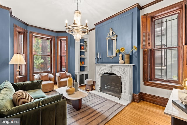 1519 Kingman Pl NW, Washington, DC 20005 - living area with hardwood / wood-style floors, a chandelier, ornamental molding, a premium fireplace, and baseboards