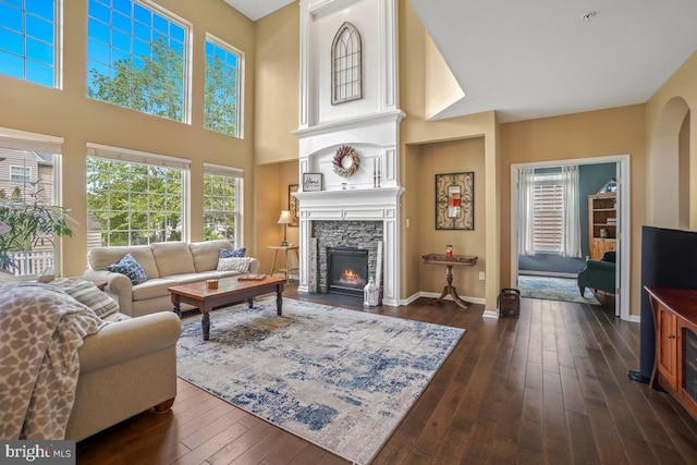 6218 Alan Linton Blvd W, Frederick, MD 21703 - living area featuring a fireplace, dark wood-style flooring, baseboards, and a high ceiling