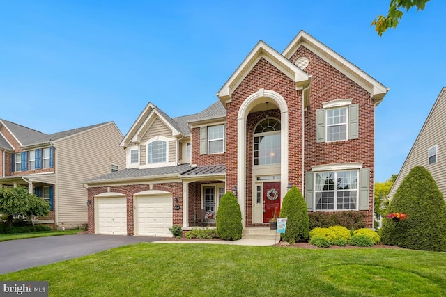 6218 Alan Linton Blvd W, Frederick, MD 21703 - view of front of house with brick siding, asphalt driveway, a front lawn, a shingled roof, and a garage