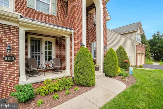 6218 Alan Linton Blvd W, Frederick, MD 21703 - entrance to property with brick siding, a garage, and a lawn