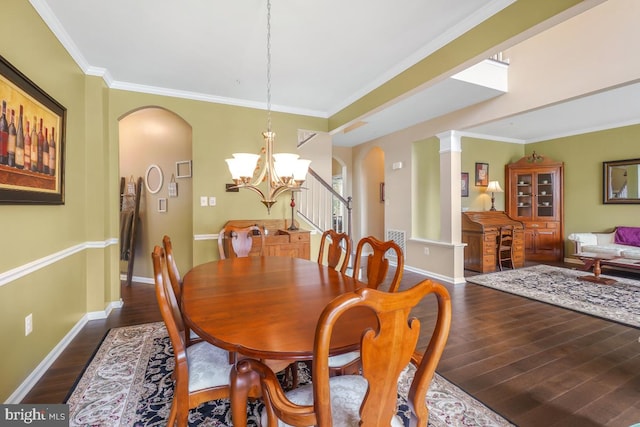 6218 Alan Linton Blvd W, Frederick, MD 21703 - dining room with arched walkways, dark wood-type flooring, a chandelier, baseboards, and crown molding