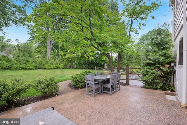 view of patio featuring outdoor dining area