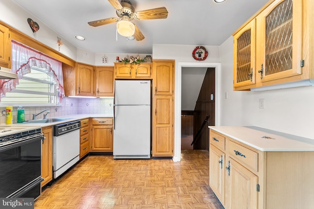 kitchen featuring white appliances, a sink, light countertops, recessed lighting, and ceiling fan