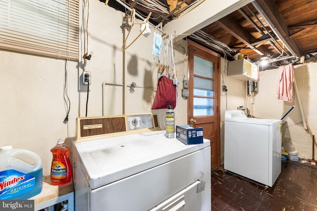 laundry area featuring washer and clothes dryer and tile patterned floors
