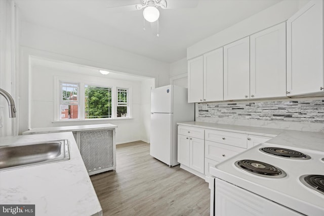 237 Roland Rd, Brookhaven, PA 19015 - kitchen with white appliances, a ceiling fan, white cabinets, and tasteful backsplash