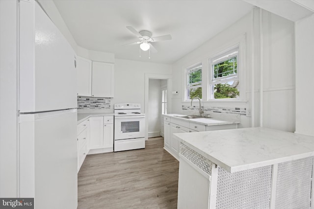 237 Roland Rd, Brookhaven, PA 19015 - kitchen featuring white appliances, a sink, tasteful backsplash, and white cabinets