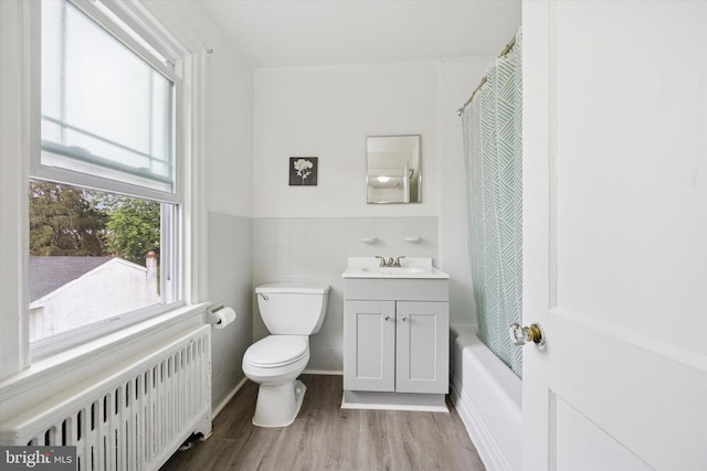 237 Roland Rd, Brookhaven, PA 19015 - full bathroom with radiator heating unit, wood finished floors, toilet, vanity, and wainscoting