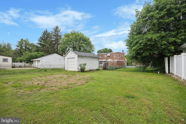 237 Roland Rd, Brookhaven, PA 19015 - view of yard featuring an outbuilding and a detached garage