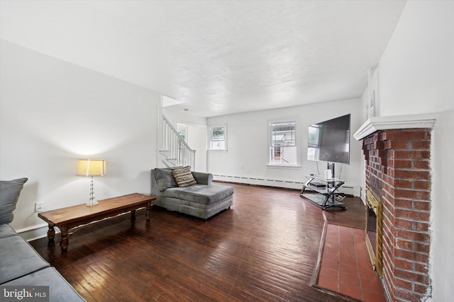 237 Roland Rd, Brookhaven, PA 19015 - living area featuring stairs, a fireplace, hardwood / wood-style floors, and baseboards