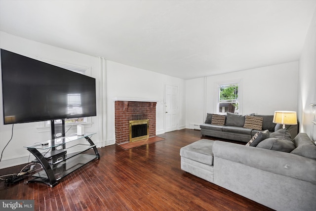 237 Roland Rd, Brookhaven, PA 19015 - living area featuring wood-type flooring, baseboard heating, and a fireplace