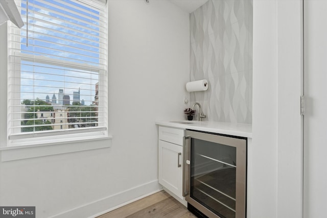1325 N 17th St Unit A, Philadelphia, PA 19121 - indoor wet bar with wine cooler, light wood-style floors, and baseboards