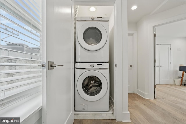 1325 N 17th St Unit A, Philadelphia, PA 19121 - washroom featuring stacked washing machine and dryer, wood finished floors, baseboards, and recessed lighting