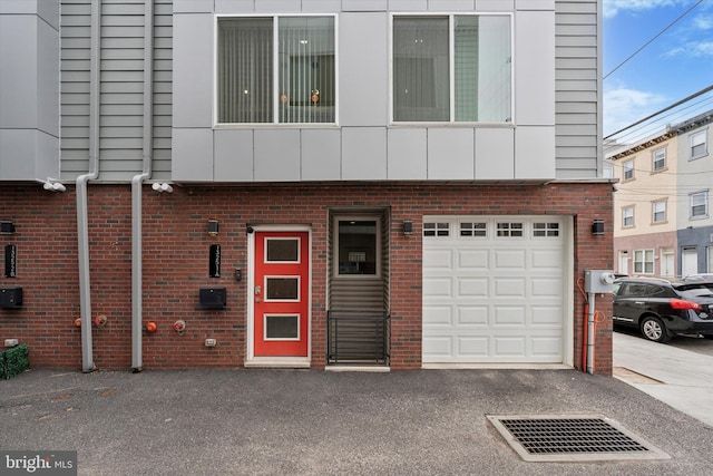 1325 N 17th St Unit A, Philadelphia, PA 19121 - view of building exterior featuring a garage and driveway