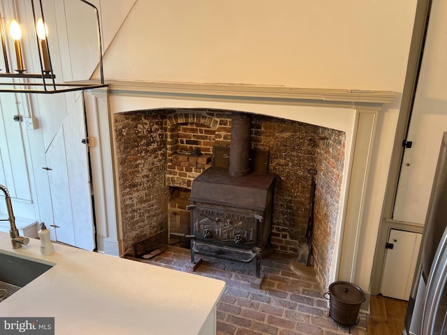 detailed view of a wood stove and freestanding refrigerator