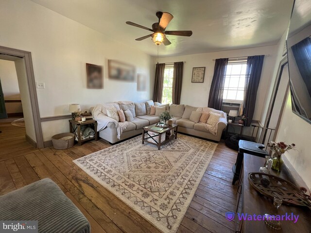 living area with hardwood / wood-style floors, ceiling fan, and cooling unit