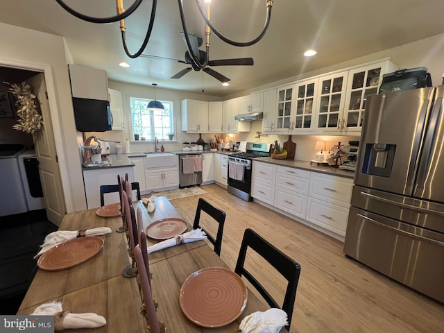 dining space featuring light wood finished floors, a ceiling fan, and recessed lighting