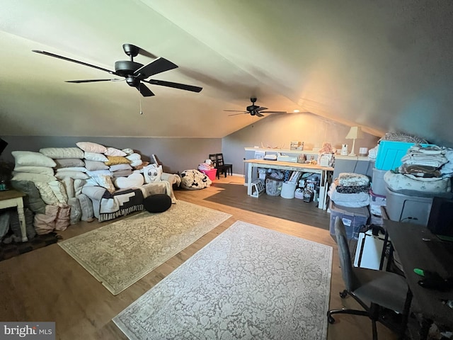 additional living space with a ceiling fan, lofted ceiling, and wood finished floors