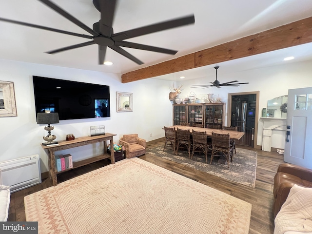 living room featuring a ceiling fan, dark wood-type flooring, recessed lighting, beam ceiling, and heating unit