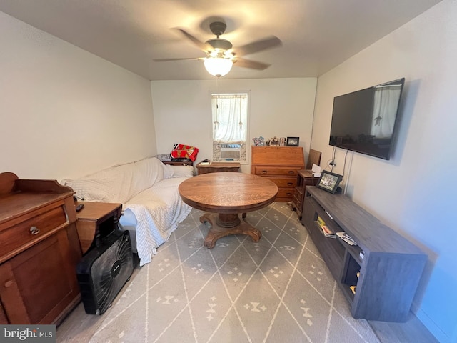 living area with ceiling fan