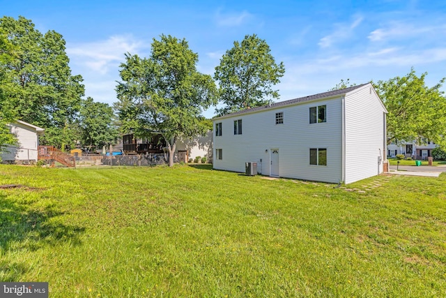 3607 Stonesboro Rd, Fort Washington, MD 20744 - rear view of property with central AC unit and a lawn