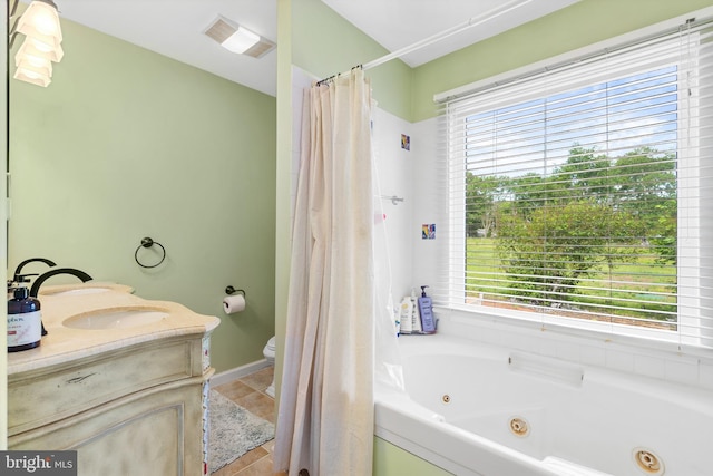 522 Creek Rd, Moorestown, NJ 08057 - bathroom featuring a jetted tub, toilet, tile patterned floors, vanity, and baseboards