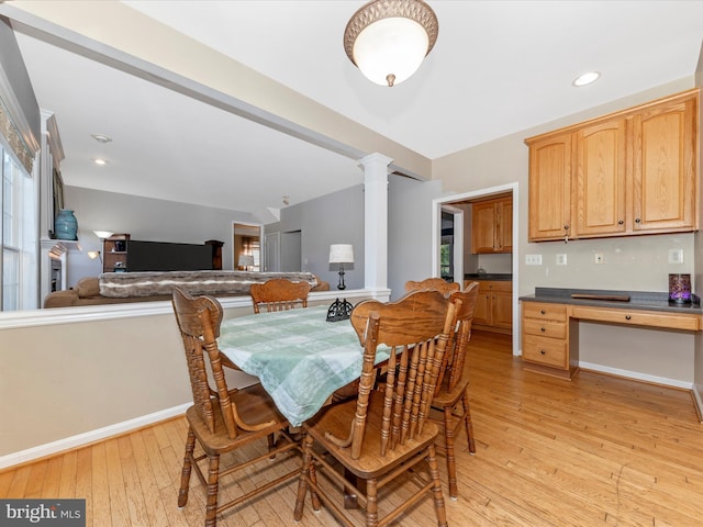 4 Jeffrey Ln, Brunswick, MD 21758 - dining space featuring light wood-style flooring, decorative columns, plenty of natural light, and a desk
