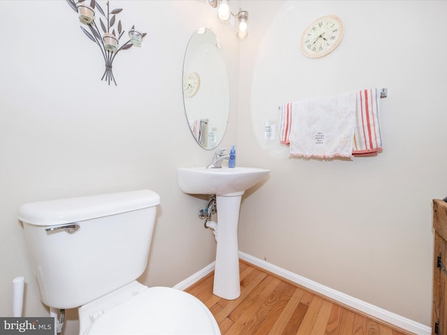 4 Jeffrey Ln, Brunswick, MD 21758 - half bathroom featuring toilet and wood finished floors