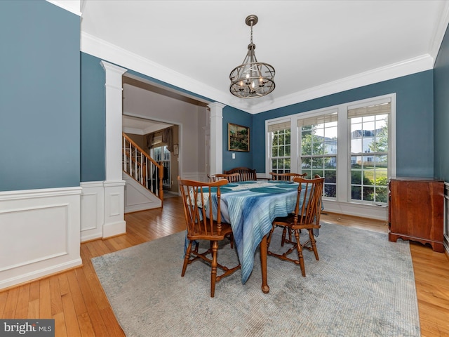 4 Jeffrey Ln, Brunswick, MD 21758 - dining room with a chandelier, ornamental molding, stairway, light wood finished floors, and ornate columns