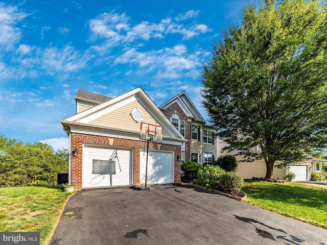 4 Jeffrey Ln, Brunswick, MD 21758 - view of side of property with brick siding, asphalt driveway, a lawn, and a garage