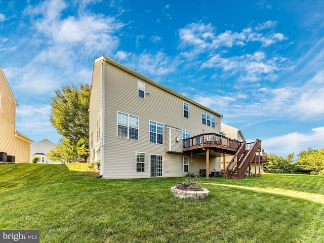 4 Jeffrey Ln, Brunswick, MD 21758 - back of house featuring a wooden deck, a lawn, stairway, and a fire pit
