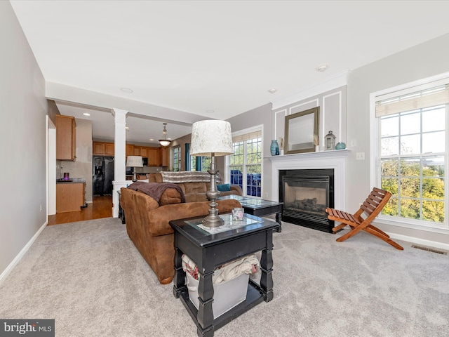 4 Jeffrey Ln, Brunswick, MD 21758 - living room with a fireplace with flush hearth, ornate columns, light carpet, and recessed lighting